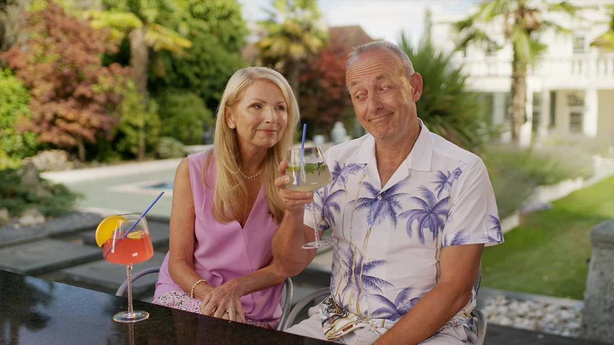 Couple enjoying a sunny holiday setting for AllClear Travel Insurance