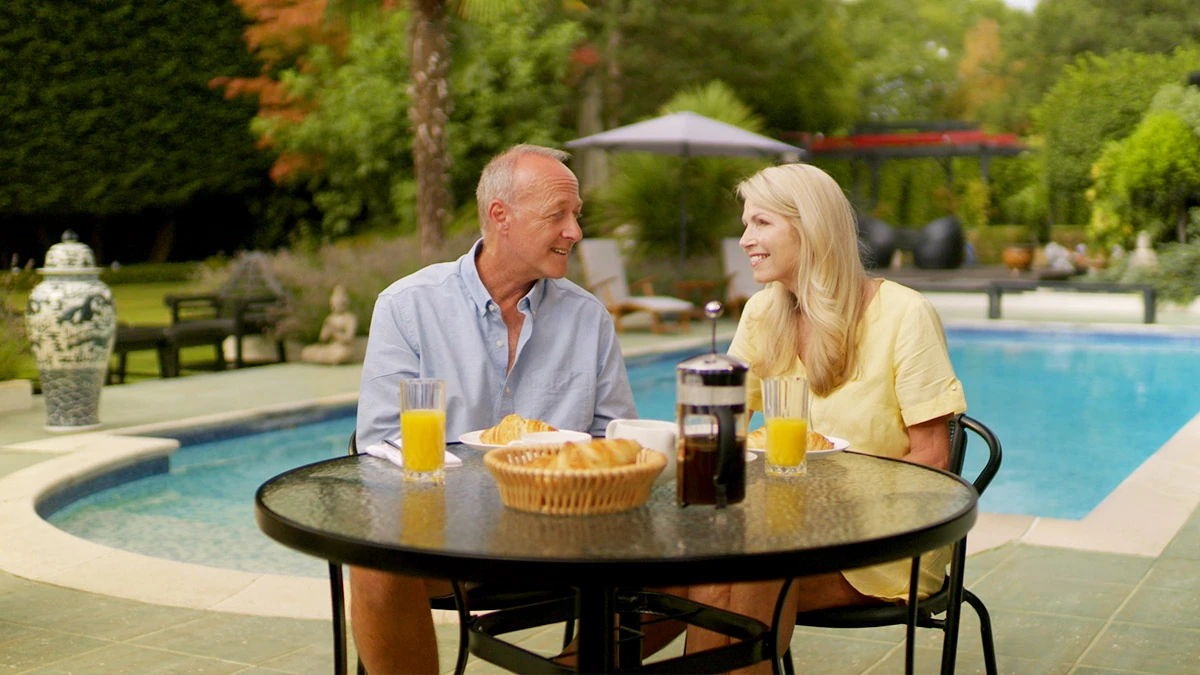 Couple enjoying a sunny holiday setting for AllClear Travel Insurance