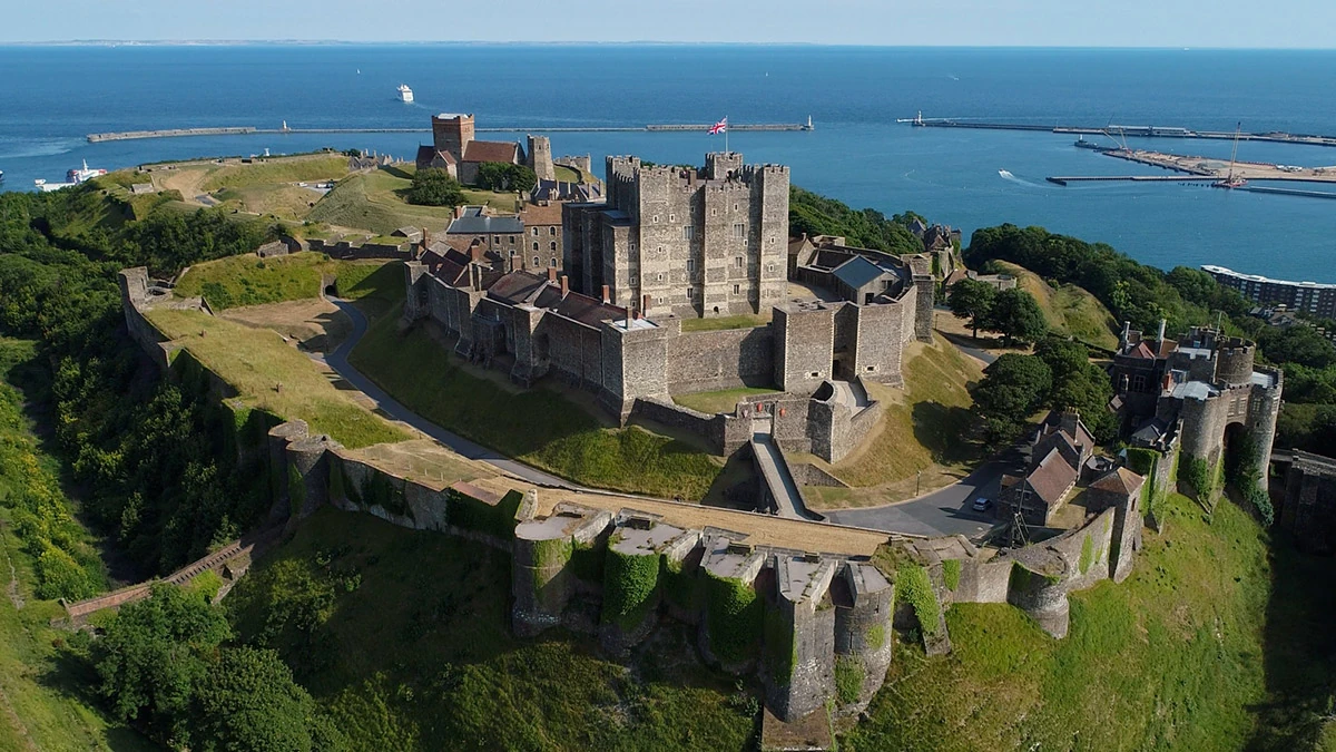 Aerial view of an English Heritage castle beside the coast