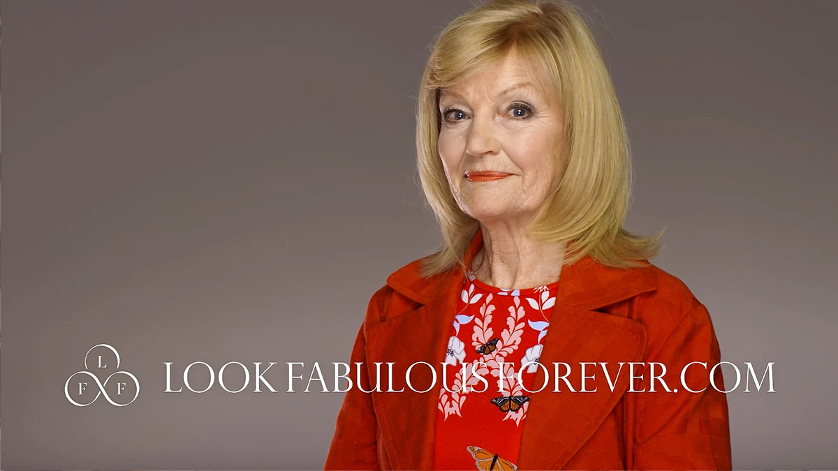 Look Fabulous Forever advert featuring a woman in red with the brand website on screen